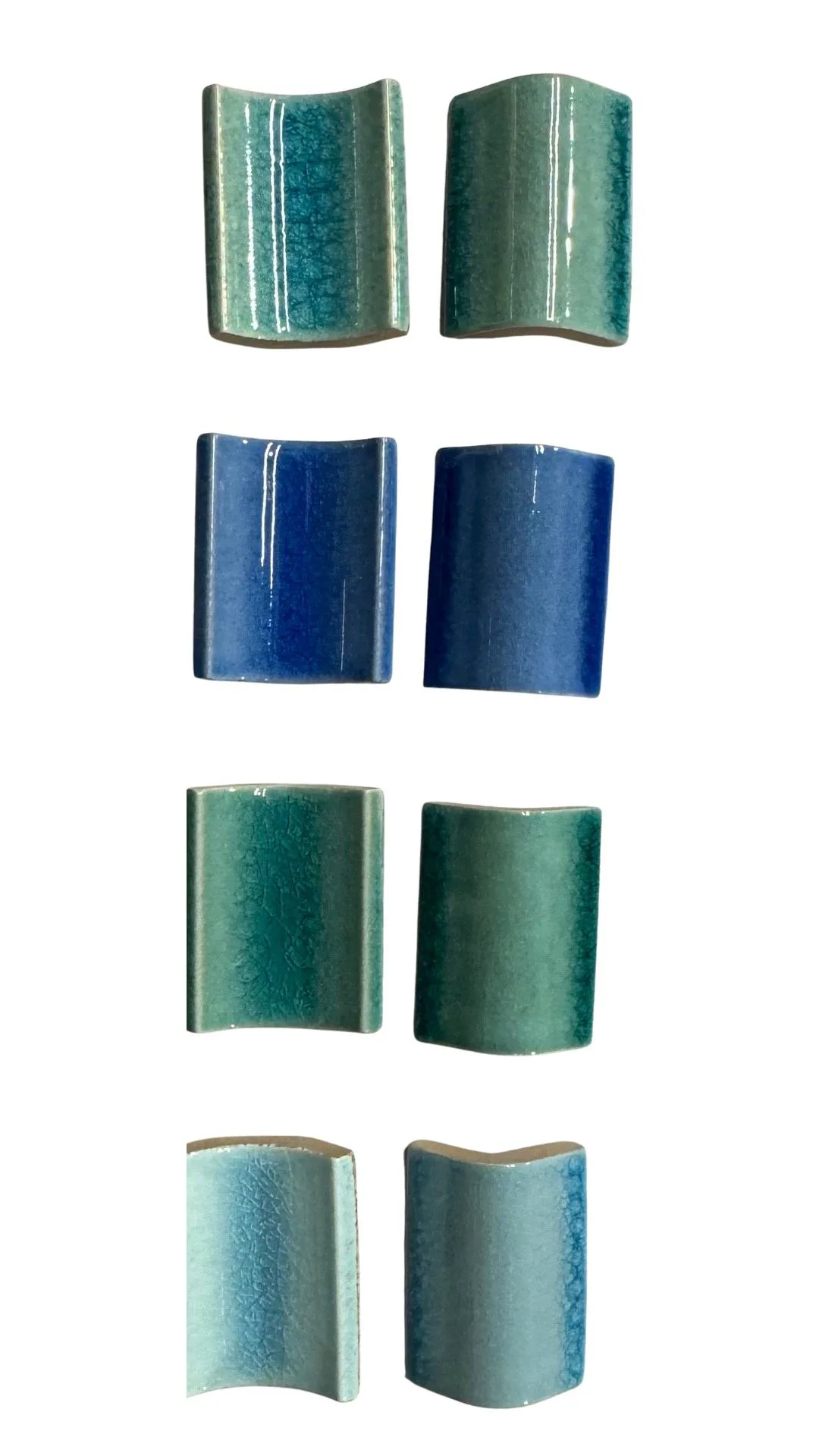 Ceramic accessory tiles arranged as a glazed pool finishing set.