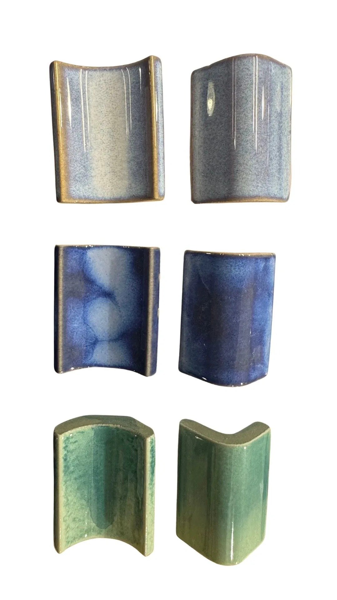 Glazed ceramic trim tiles for a pool installation.
