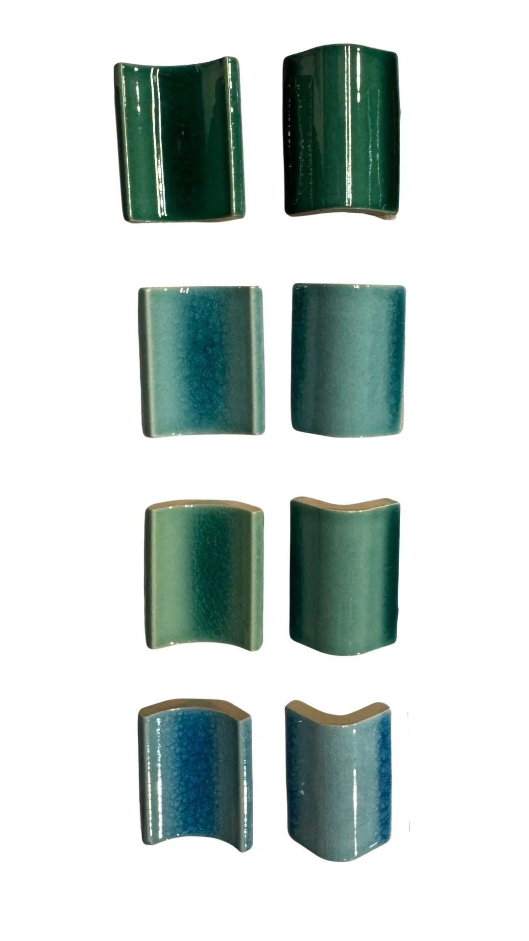 Glazed ceramic corner trim pieces for pool edges.