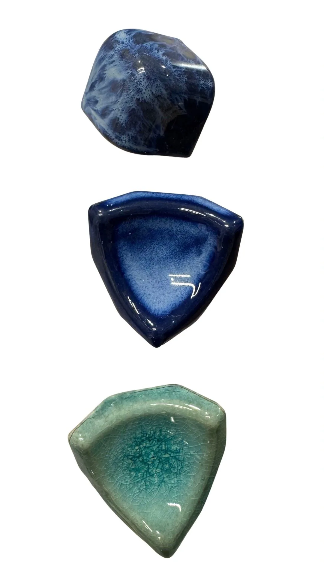 Triangular glazed ceramic pieces for a pool border detail.