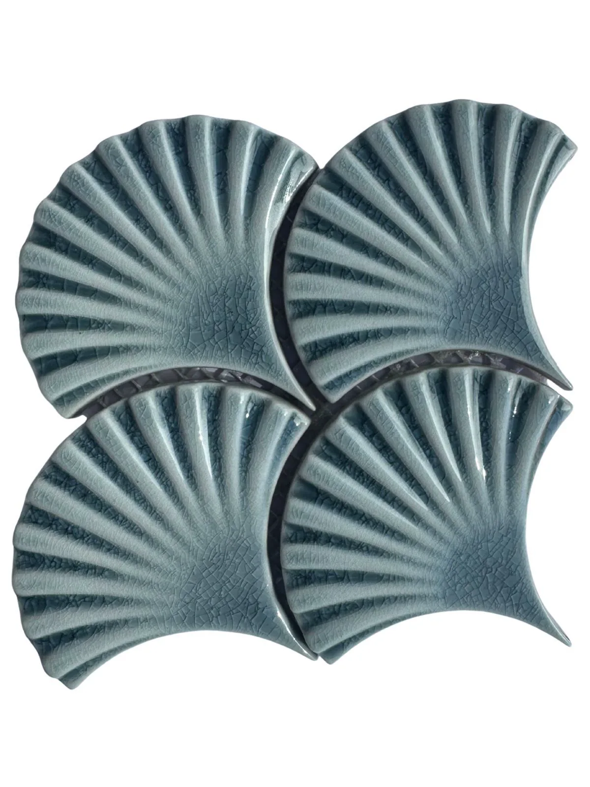 Blue fan-shaped glazed ceramic mosaic pieces.