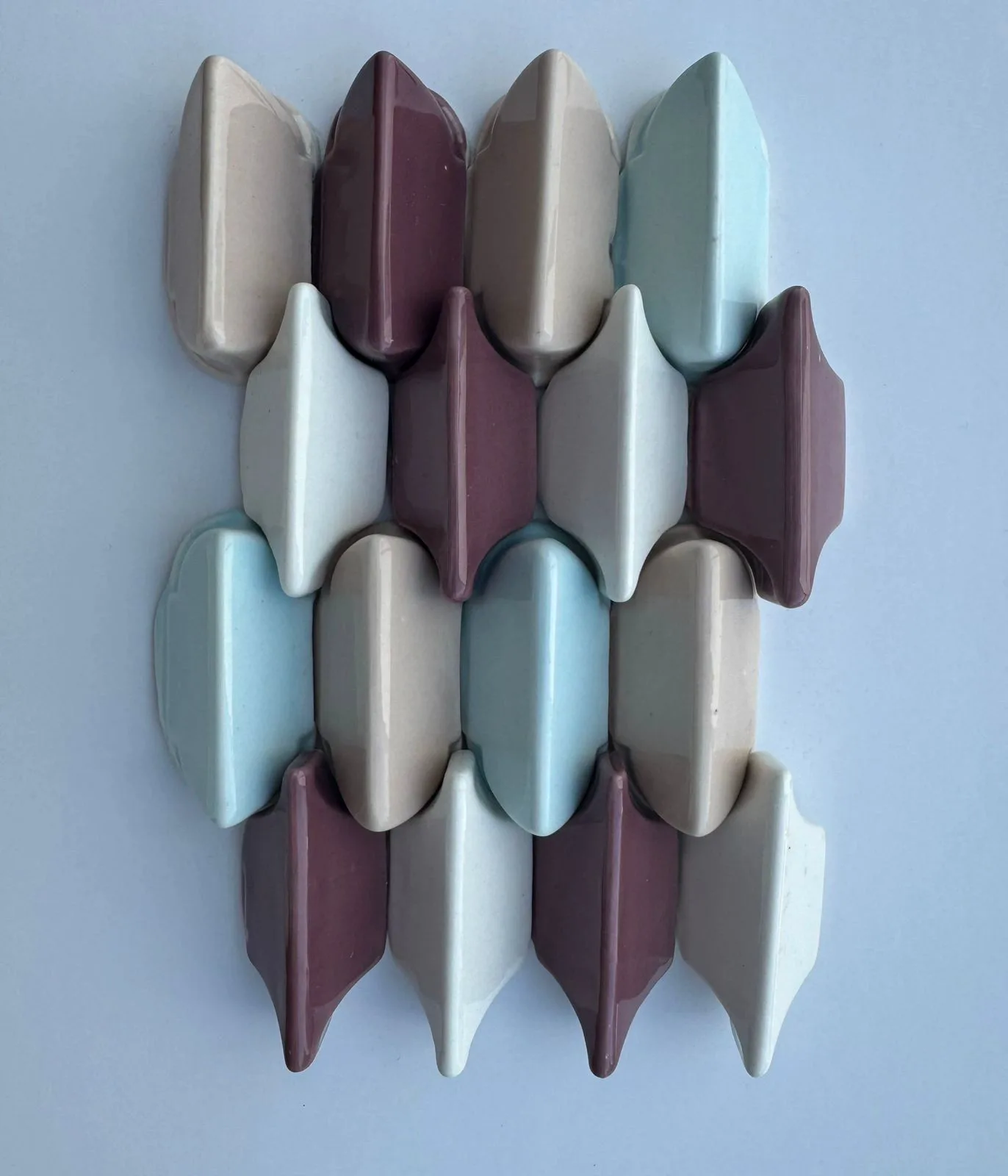 Cream, burgundy, and pale blue 3D glazed ceramic wall tile mosaic.