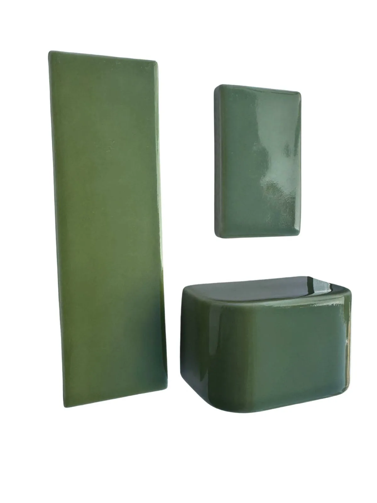 Olive green glazed ceramic pieces in varied sizes.