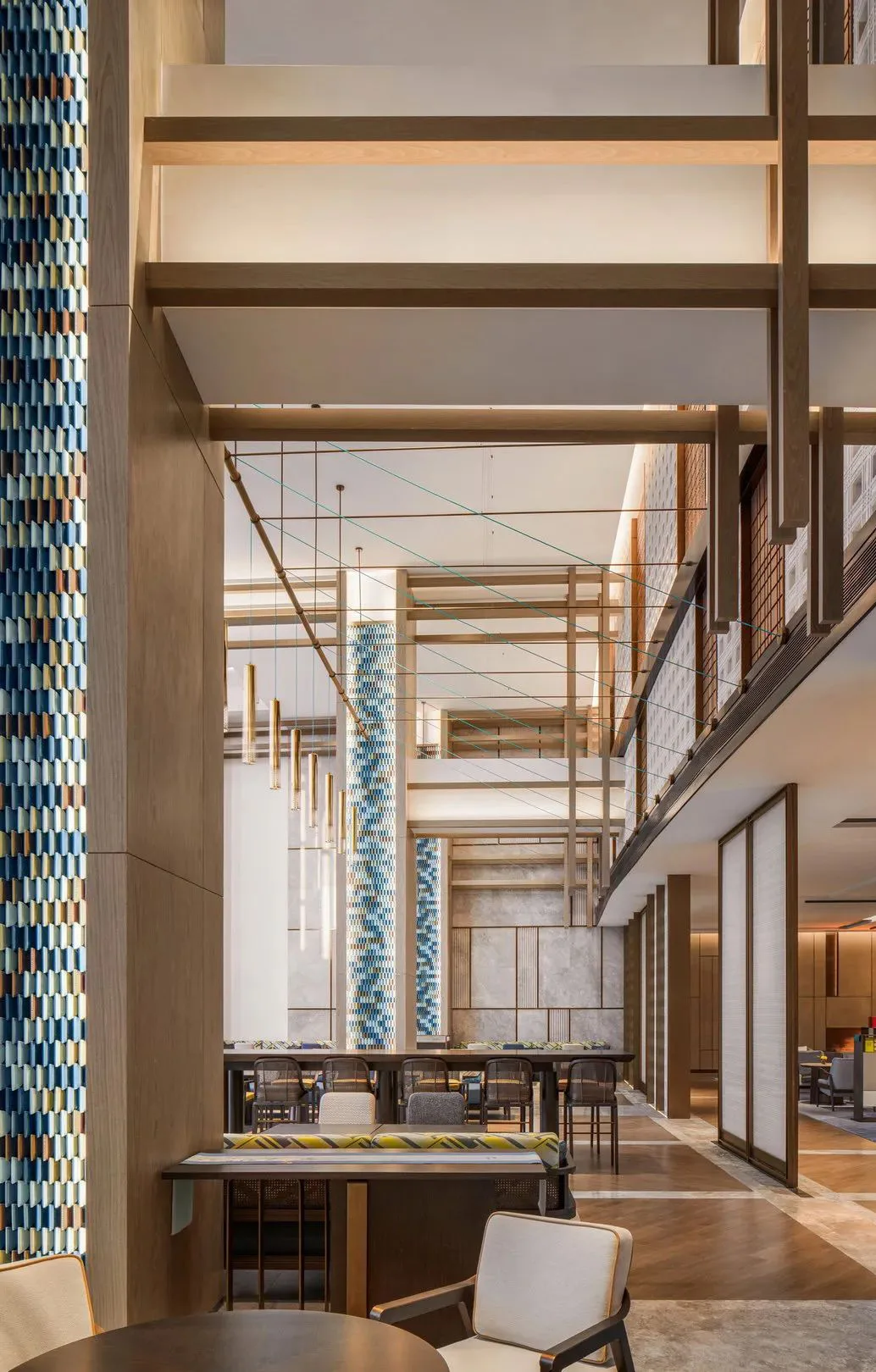 Taizhou Juntai Hotel interior with a dimensional glazed mosaic feature wall.