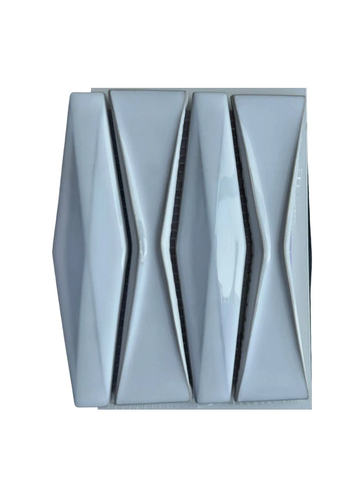 White 3D glazed ceramic mosaic pieces.