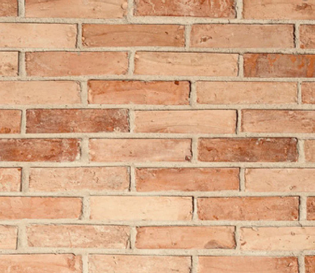 CALIBRATED ORANGE reclaimed brick wall texture.