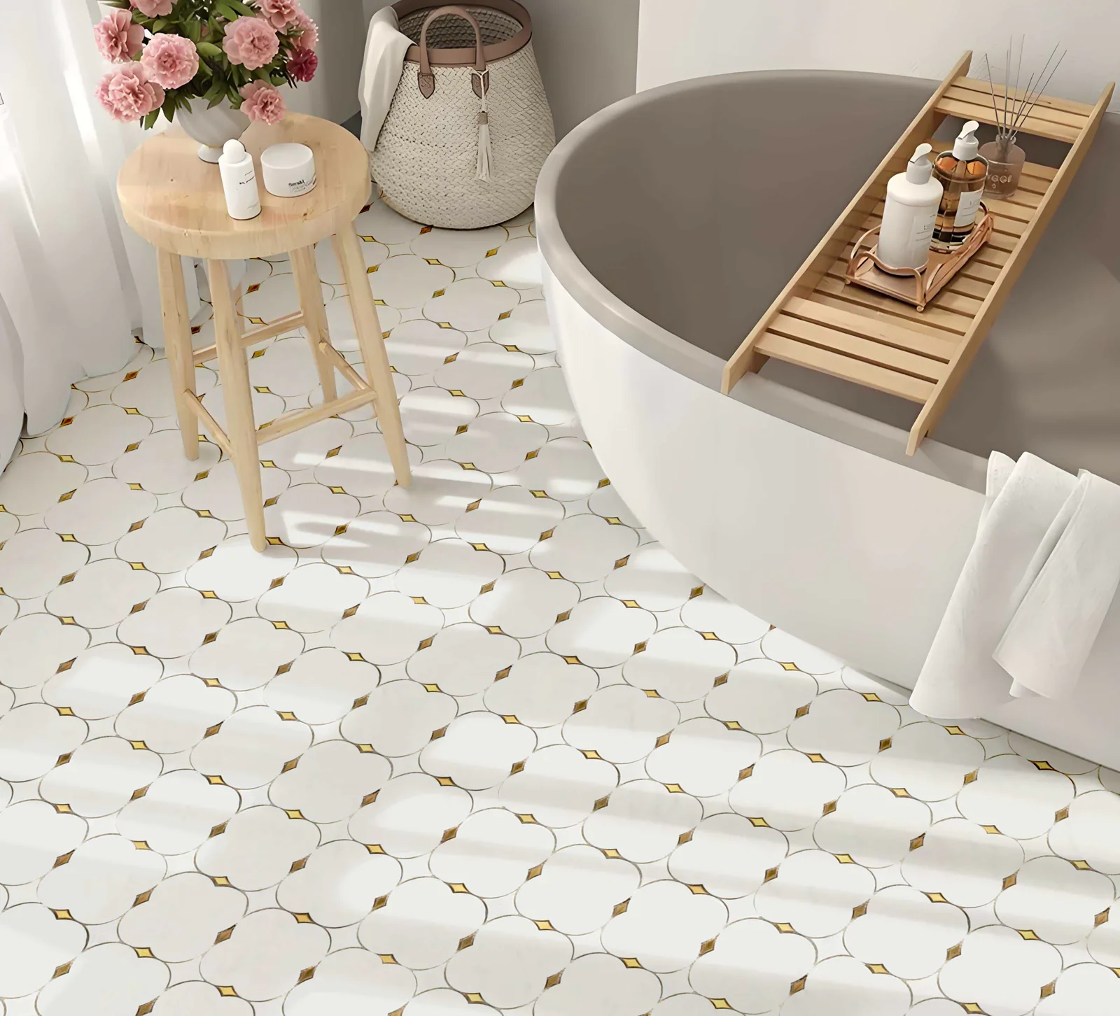 Finished bathroom with a white mosaic floor and small gold accents around a freestanding bath.