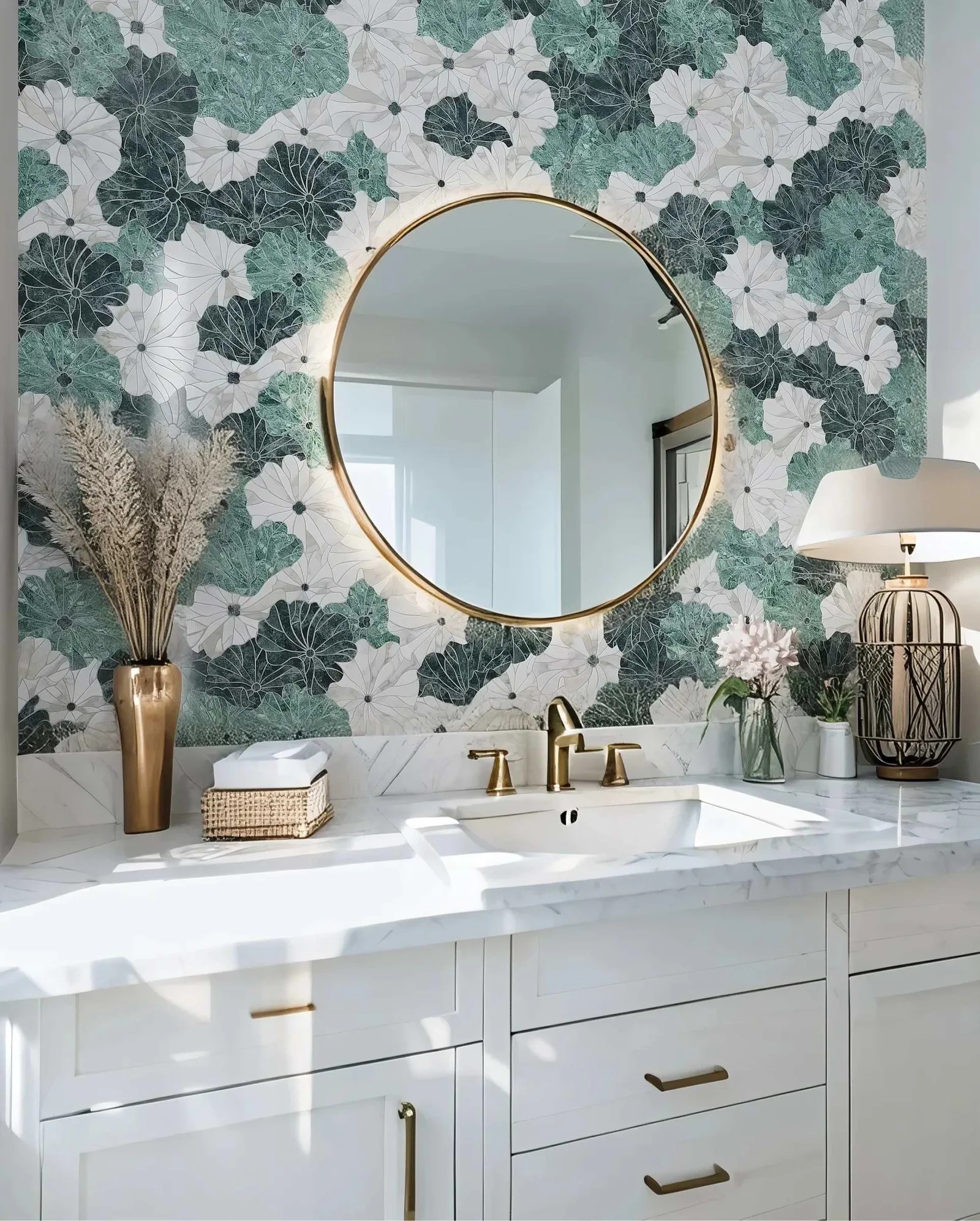 Finished vanity with a green and white botanical mosaic wall and a round brass-framed mirror.