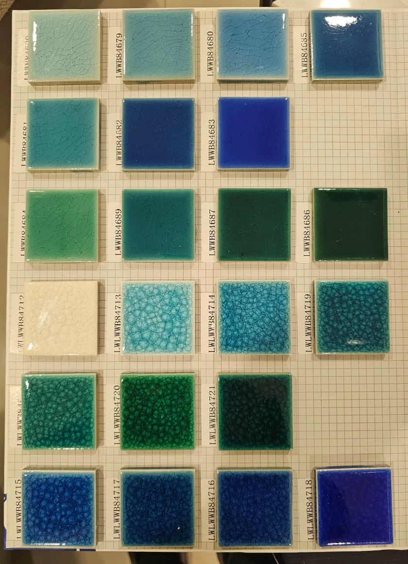 Glazed swimming pool tile samples in aqua, blue, green, and turquoise tones.