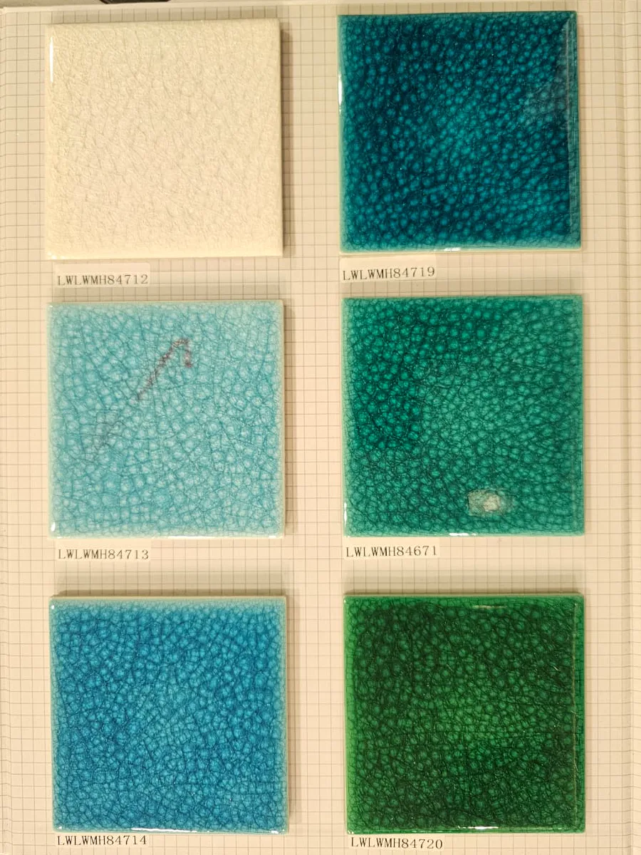 Textured glazed swimming pool tile samples in cream, turquoise, and green tones.