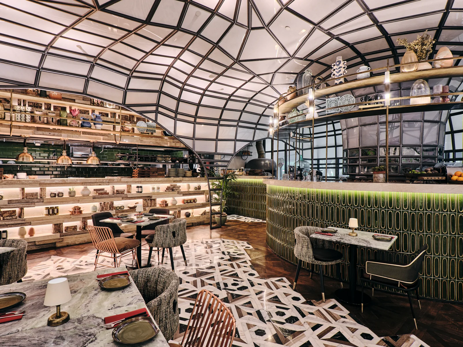 Material-rich food hall interior with patterned flooring and custom details.