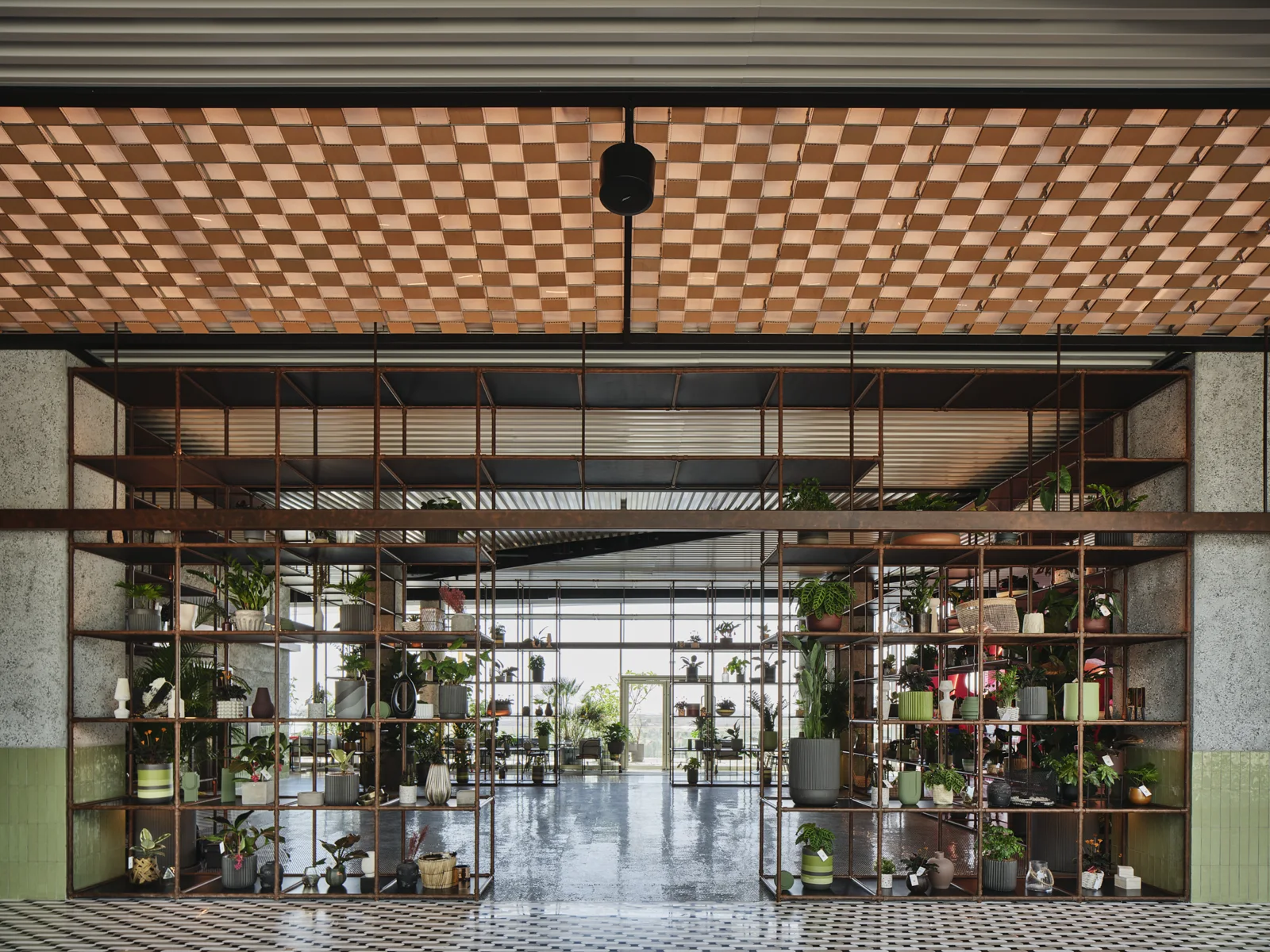 Public interior space finished with textured surfaces and architectural lighting.